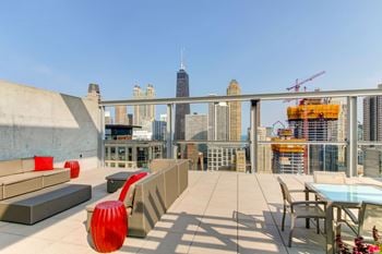 Cityscape Morning View in River North Chicago, IL with Rooftop Outdoor Living Room  with City Skyline and Lake Michigan Views